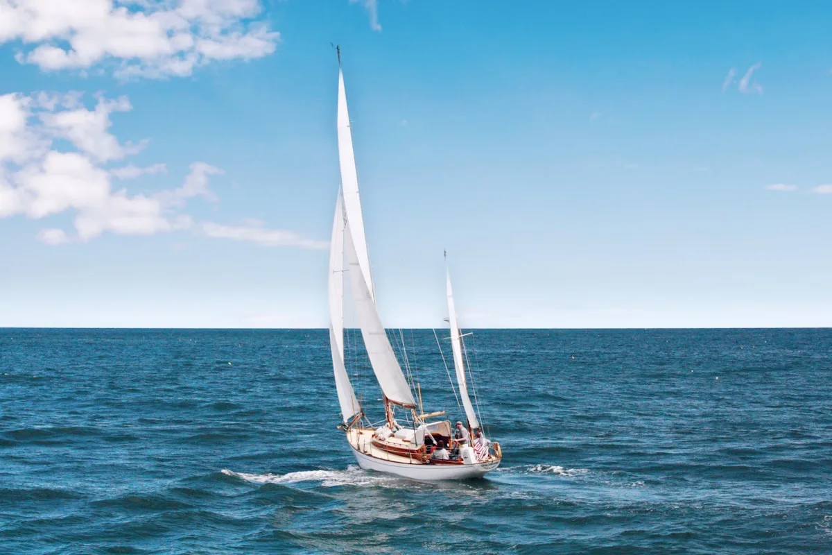 Catamaran sailing near tropical island